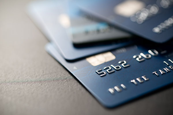 credit-cards-stacked-on-gray-table-finance-concep